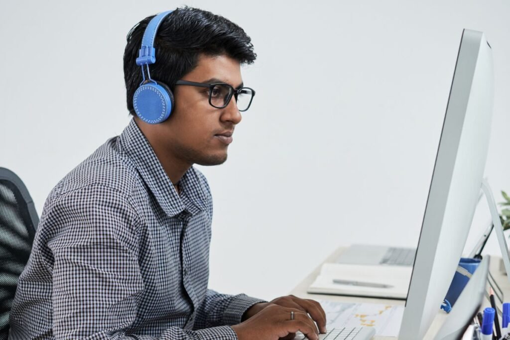 IT Worker enjoying music while working