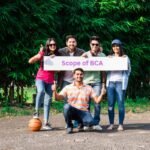 students on a basketball ground holding a banner with bca scope in nepal