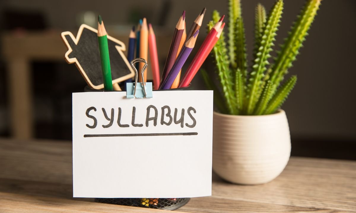 pencil cup holding color pencils and syllabus written card