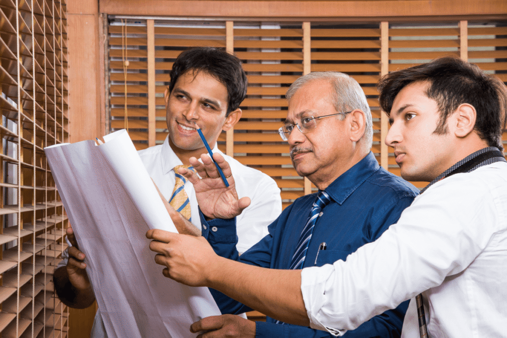 team of nepal architects discusing about the building plan