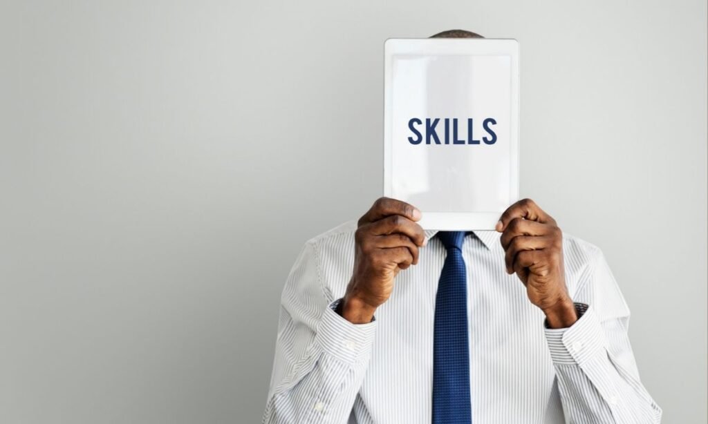 recruiter showing skills banner with both of hands covering his face